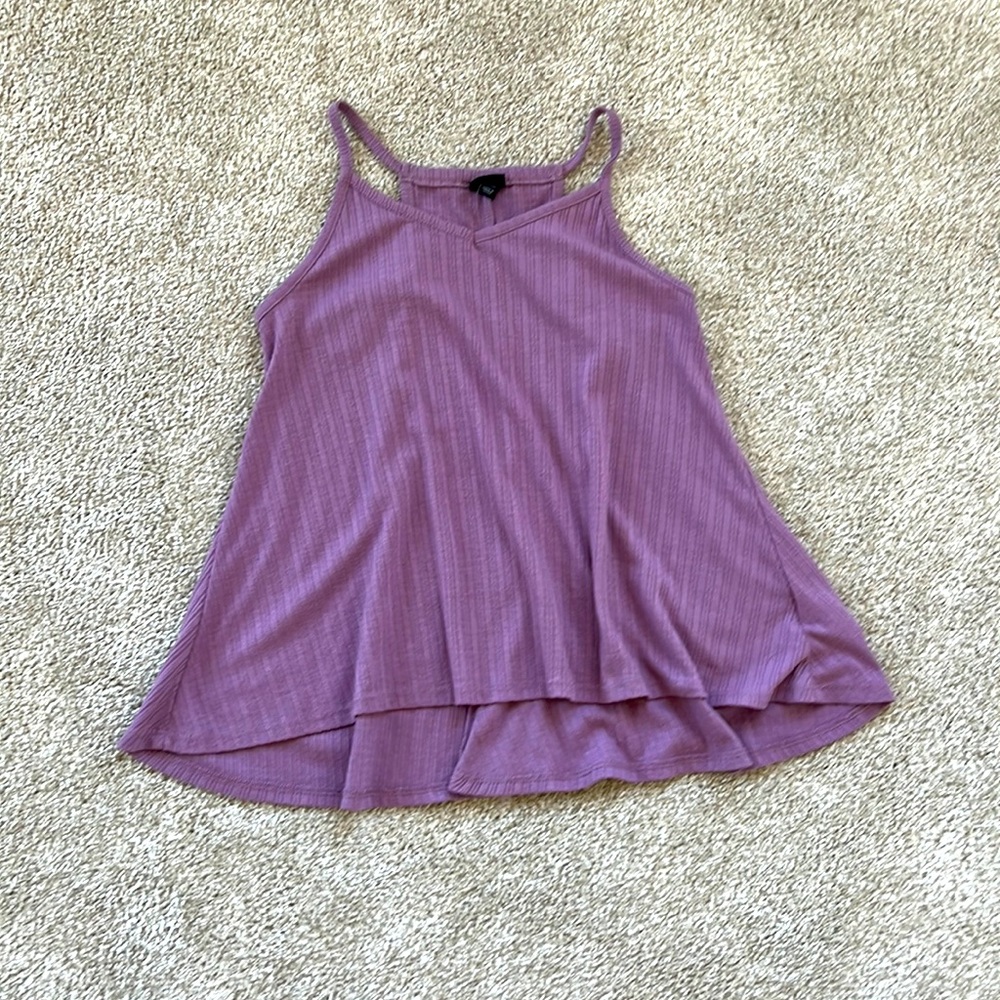 A loose purple tank top, ribbed